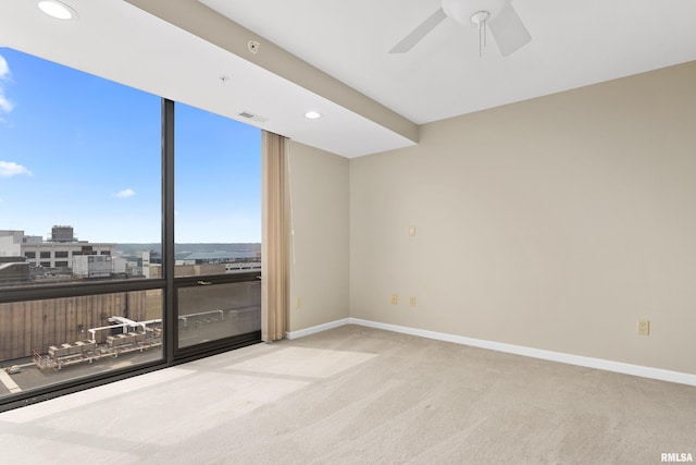 123 SW Jefferson St Unit E10C, Peoria, IL 61602 - carpeted empty room featuring a ceiling fan and recessed lighting
