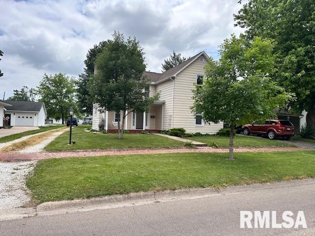 964 E Locust St, Canton, IL 61520 - obstructed view of property with a front lawn, driveway, and a garage