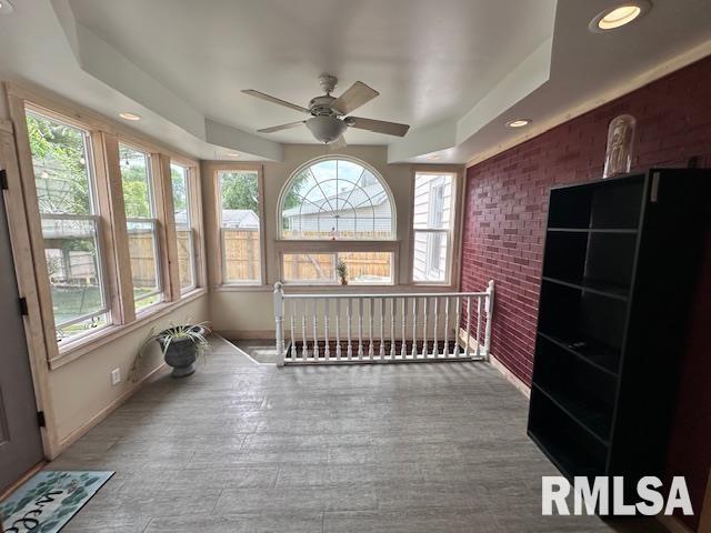 964 E Locust St, Canton, IL 61520 - sunroom / solarium with brick wall, healthy amount of natural light, recessed lighting, and wood finished floors