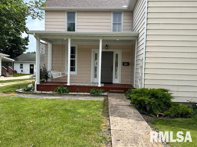 964 E Locust St, Canton, IL 61520 - view of front of property featuring covered porch and a front lawn