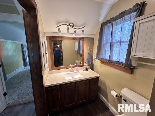 964 E Locust St, Canton, IL 61520 - bathroom featuring vanity and wood finished floors