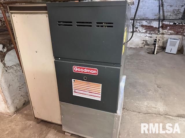 964 E Locust St, Canton, IL 61520 - utility room with heating unit