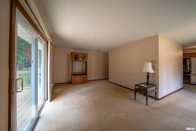 748 E Poplet Hollow Rd, Peoria, IL 61614 - unfurnished room with light carpet and baseboards