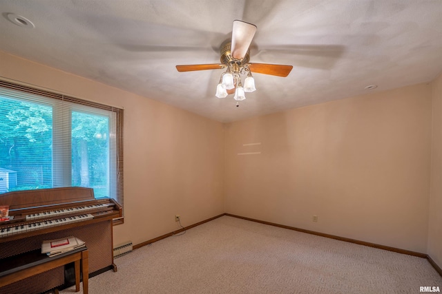 748 E Poplet Hollow Rd, Peoria, IL 61614 - spare room featuring a ceiling fan and light colored carpet