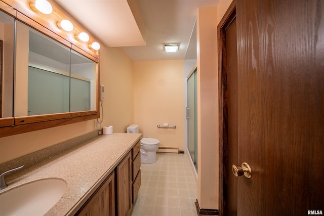 748 E Poplet Hollow Rd, Peoria, IL 61614 - full bath with tile patterned floors, vanity, a shower with shower door, and a baseboard heating unit