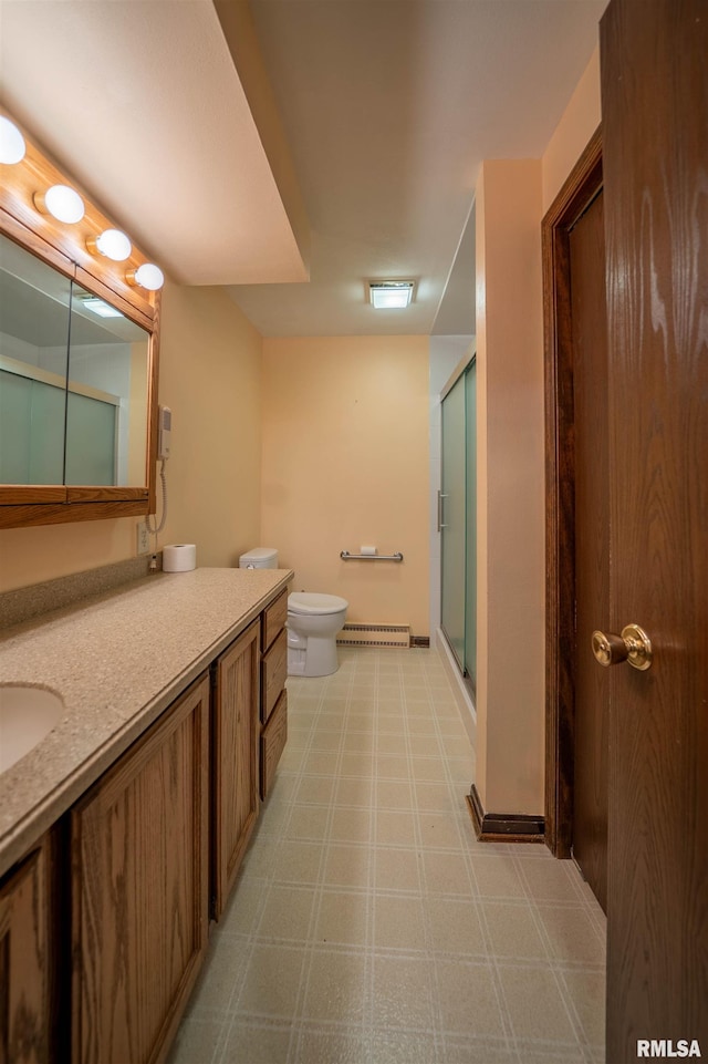 748 E Poplet Hollow Rd, Peoria, IL 61614 - full bath with tile patterned floors, vanity, a shower stall, and a baseboard radiator