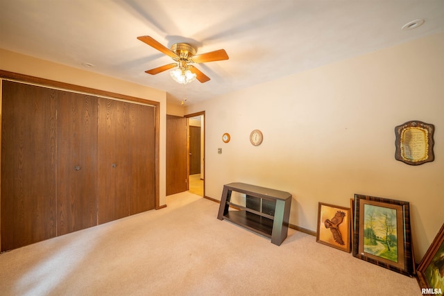 748 E Poplet Hollow Rd, Peoria, IL 61614 - unfurnished bedroom featuring carpet, a closet, and a ceiling fan