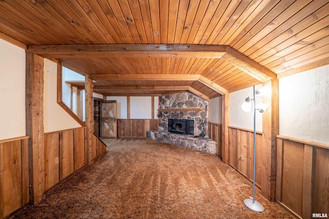 748 E Poplet Hollow Rd, Peoria, IL 61614 - unfurnished living room with wood ceiling, wood walls, wainscoting, a fireplace, and carpet floors