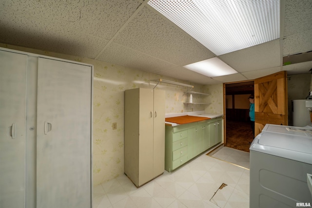 748 E Poplet Hollow Rd, Peoria, IL 61614 - laundry area with washer / clothes dryer, water heater, light flooring, and wallpapered walls