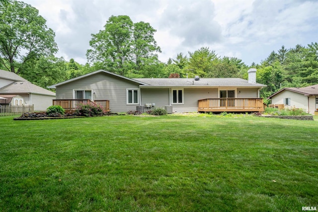 748 E Poplet Hollow Rd, Peoria, IL 61614 - rear view of house featuring a deck and a lawn