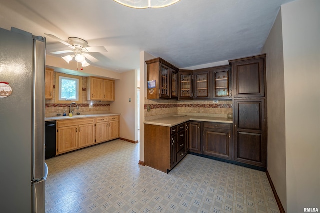 748 E Poplet Hollow Rd, Peoria, IL 61614 - kitchen featuring freestanding refrigerator, backsplash, light countertops, ceiling fan, and dishwasher