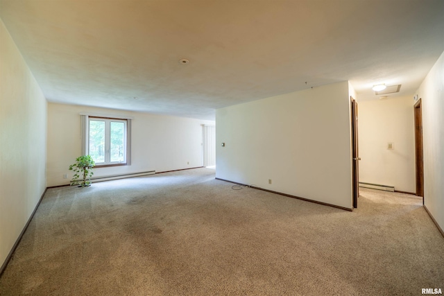 748 E Poplet Hollow Rd, Peoria, IL 61614 - unfurnished room featuring a baseboard heating unit and light carpet