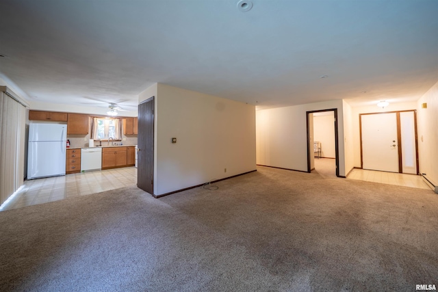 748 E Poplet Hollow Rd, Peoria, IL 61614 - unfurnished living room featuring light colored carpet and a sink