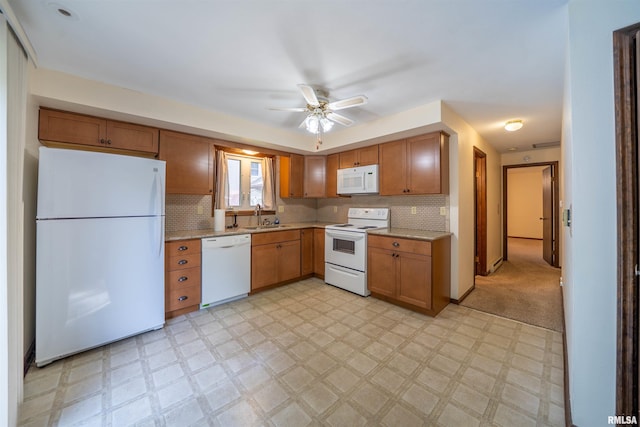 748 E Poplet Hollow Rd, Peoria, IL 61614 - kitchen with white appliances, light flooring, a ceiling fan, and backsplash
