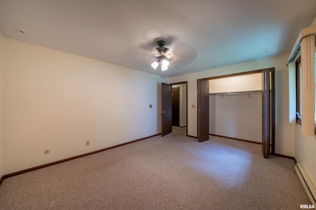 748 E Poplet Hollow Rd, Peoria, IL 61614 - unfurnished bedroom featuring a baseboard heating unit, light carpet, a closet, and ceiling fan