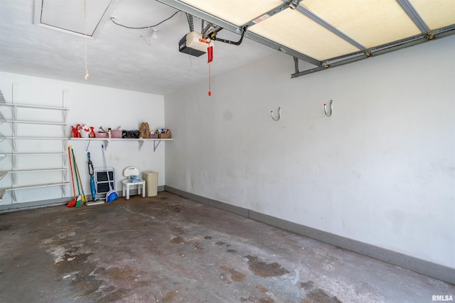 748 E Poplet Hollow Rd, Peoria, IL 61614 - garage featuring a garage door opener and baseboards
