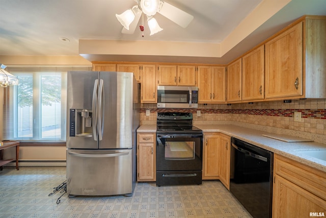 748 E Poplet Hollow Rd, Peoria, IL 61614 - kitchen with black appliances, light countertops, baseboard heating, and tasteful backsplash