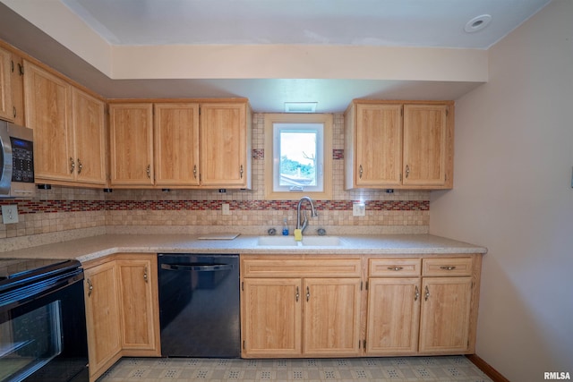 748 E Poplet Hollow Rd, Peoria, IL 61614 - kitchen with black appliances, tasteful backsplash, light countertops, and light brown cabinetry