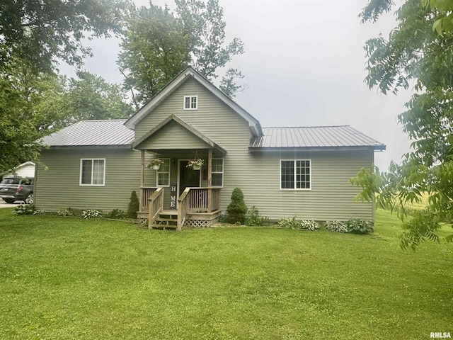 442 W Oak St, Smithfield, IL 61477 - view of front facade with a front lawn, a metal roof, and covered porch