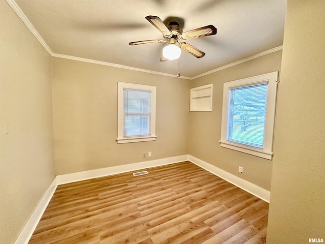 904 E Forrest Hill Ave, Peoria, IL 61603 - spare room with wood finished floors, crown molding, and a ceiling fan