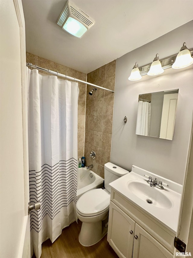 904 E Forrest Hill Ave, Peoria, IL 61603 - bathroom featuring vanity, shower / bath combo, and wood finished floors