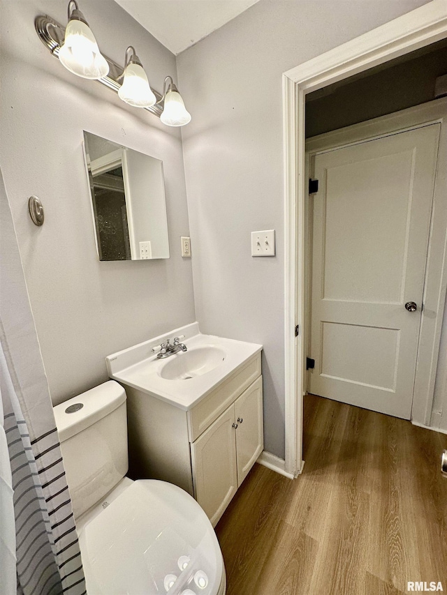 904 E Forrest Hill Ave, Peoria, IL 61603 - bathroom with vanity and wood finished floors