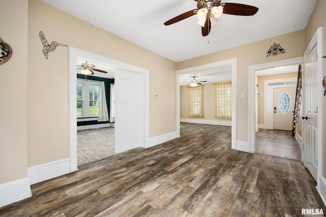 411 E 3rd St, Delavan, IL 61550 - empty room featuring a ceiling fan and dark wood-type flooring