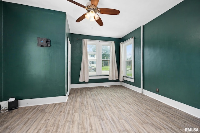 411 E 3rd St, Delavan, IL 61550 - unfurnished room with wood finished floors and a ceiling fan