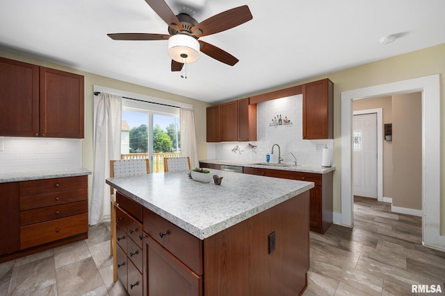 411 E 3rd St, Delavan, IL 61550 - kitchen with tasteful backsplash, light countertops, stainless steel dishwasher, and a kitchen island