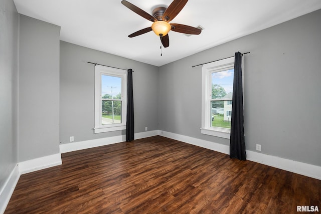 411 E 3rd St, Delavan, IL 61550 - empty room featuring plenty of natural light, wood finished floors, and ceiling fan