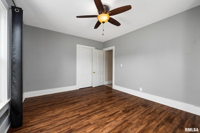 411 E 3rd St, Delavan, IL 61550 - unfurnished bedroom with wood finished floors, a closet, and a ceiling fan