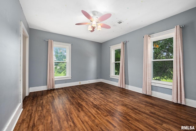 411 E 3rd St, Delavan, IL 61550 - empty room with wood finished floors and ceiling fan