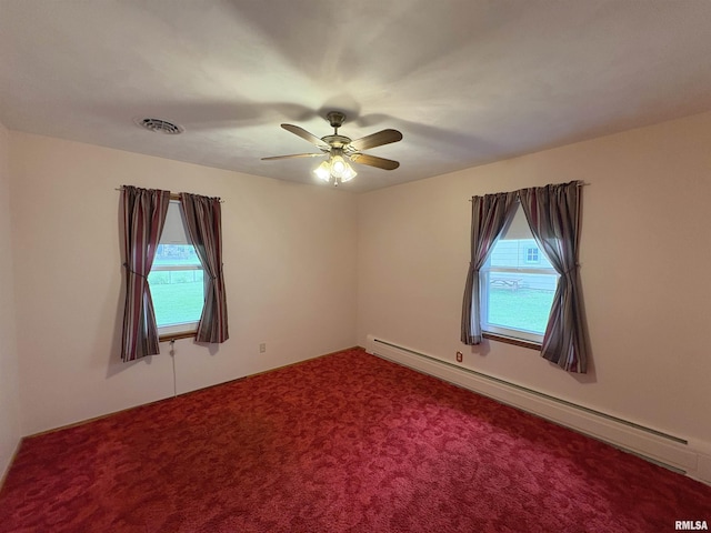 505 S Davenport St, Metamora, IL 61548 - spare room with a baseboard heating unit, ceiling fan, and carpet flooring