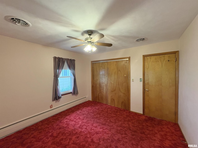 505 S Davenport St, Metamora, IL 61548 - unfurnished bedroom with a baseboard radiator, carpet floors, a ceiling fan, and a closet