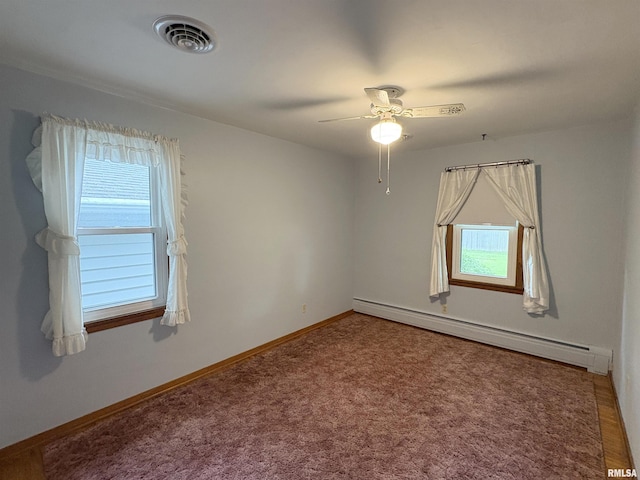 505 S Davenport St, Metamora, IL 61548 - empty room with a baseboard radiator, healthy amount of natural light, ceiling fan, and carpet