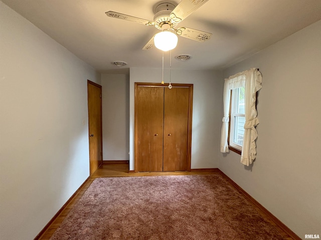 505 S Davenport St, Metamora, IL 61548 - unfurnished bedroom with a closet, ceiling fan, and wood finished floors