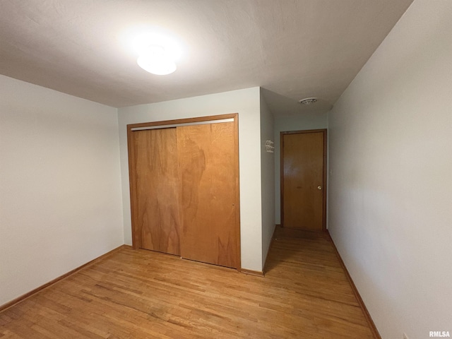 505 S Davenport St, Metamora, IL 61548 - unfurnished bedroom featuring light wood-style flooring and a closet