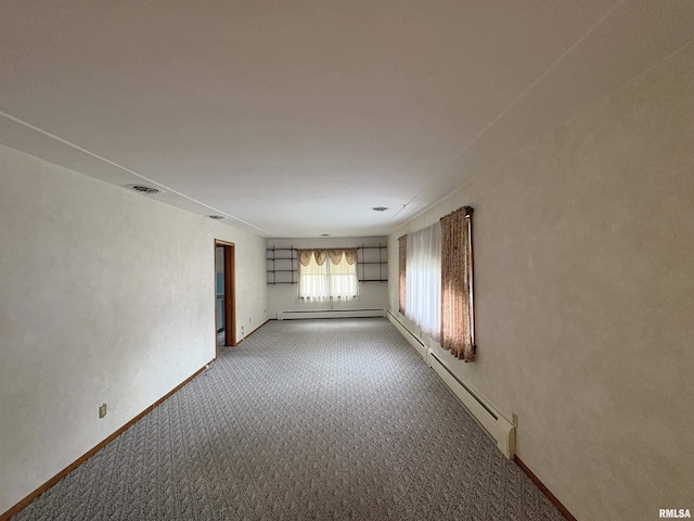 505 S Davenport St, Metamora, IL 61548 - empty room with light colored carpet and baseboard heating
