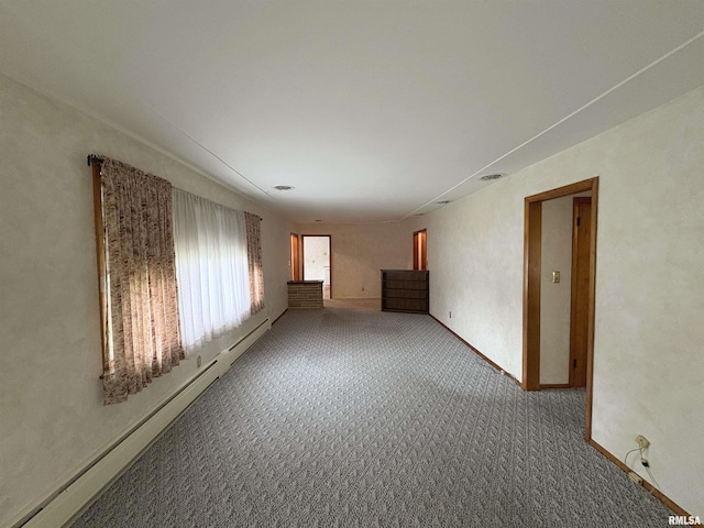 505 S Davenport St, Metamora, IL 61548 - carpeted spare room featuring a baseboard heating unit