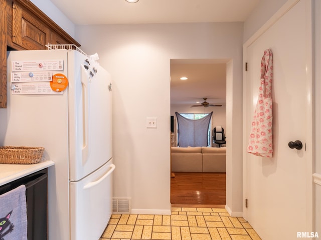 2705 N Victoria Ave, Peoria, IL 61604 - kitchen with freestanding refrigerator, recessed lighting, ceiling fan, stone tile flooring, and light countertops