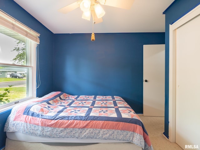 2705 N Victoria Ave, Peoria, IL 61604 - bedroom featuring multiple windows, a closet, and ceiling fan