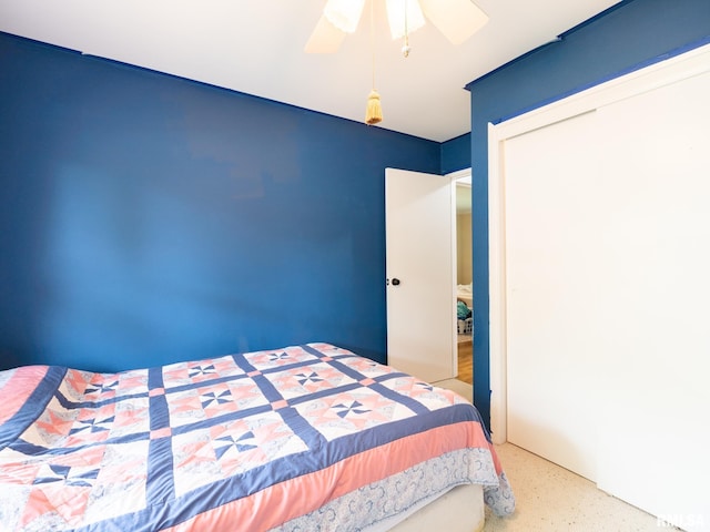 2705 N Victoria Ave, Peoria, IL 61604 - bedroom with a closet, a ceiling fan, and speckled floor