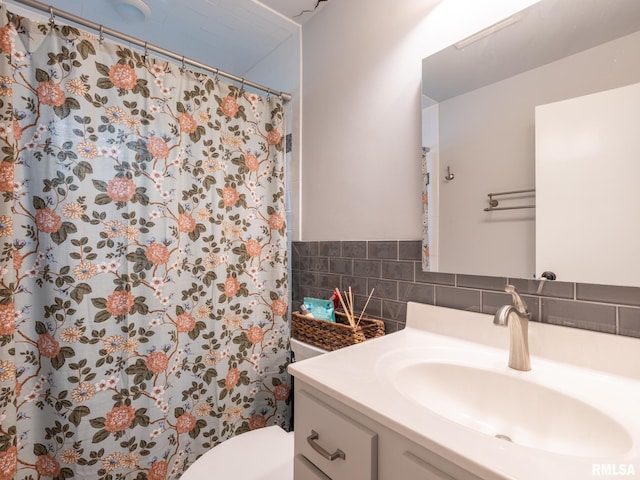 2705 N Victoria Ave, Peoria, IL 61604 - bathroom with vanity, a shower with shower curtain, and decorative backsplash