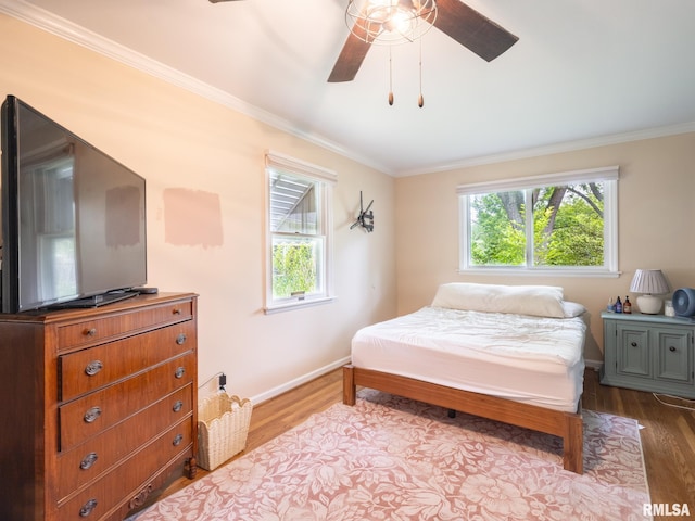 2705 N Victoria Ave, Peoria, IL 61604 - bedroom featuring crown molding, dark wood-type flooring, and a ceiling fan