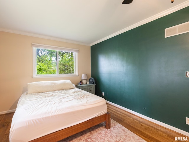 2705 N Victoria Ave, Peoria, IL 61604 - bedroom with ornamental molding and wood finished floors
