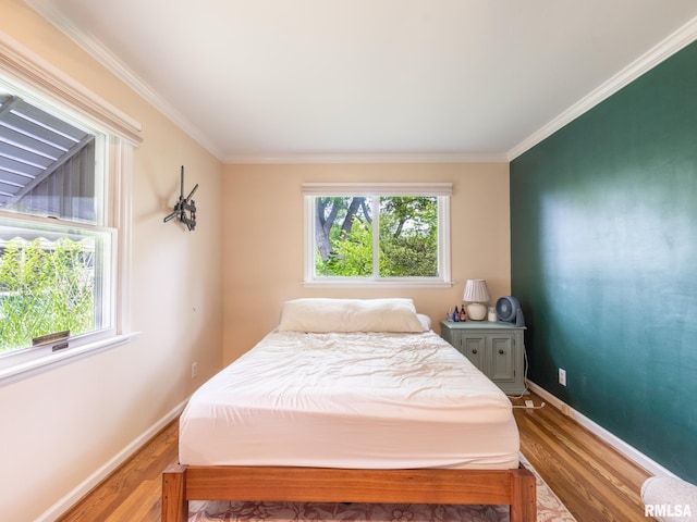 2705 N Victoria Ave, Peoria, IL 61604 - bedroom with multiple windows, wood finished floors, and ornamental molding