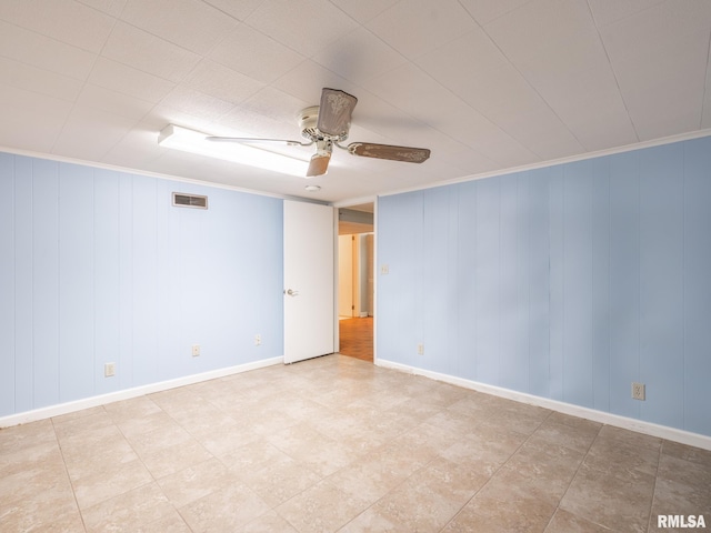 2705 N Victoria Ave, Peoria, IL 61604 - spare room featuring ceiling fan and baseboards