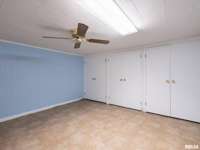 2705 N Victoria Ave, Peoria, IL 61604 - unfurnished bedroom featuring two closets and ceiling fan