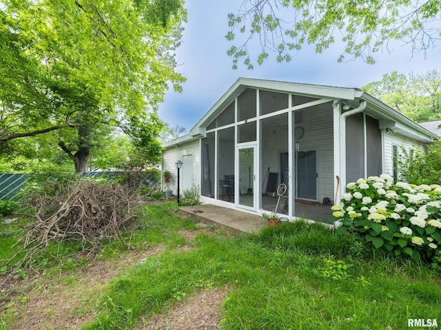 2705 N Victoria Ave, Peoria, IL 61604 - rear view of house featuring a sunroom