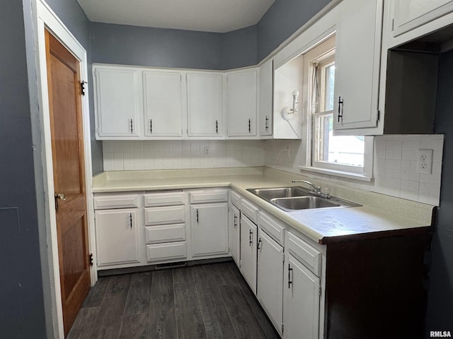 1210 W Macqueen Ave, Peoria, IL 61604 - kitchen featuring dark wood-style flooring, white cabinets, decorative backsplash, and light countertops
